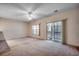 Bright living room featuring neutral walls, carpet, windows, and sliding glass doors to the balcony at 1058 Sea Mountain Hwy. # 4-203, North Myrtle Beach, SC 29582