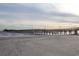 Picturesque scene of a wooden pier extending over a sandy beach at 1058 Sea Mountain Hwy. # 4-203, North Myrtle Beach, SC 29582