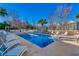 Inviting pool area featuring lounge chairs, clear blue water, and surrounding trees at 1058 Sea Mountain Hwy. # 4-203, North Myrtle Beach, SC 29582