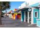 Vibrant street featuring colorful buildings, palm trees, and inviting storefronts at 1058 Sea Mountain Hwy. # 4-203, North Myrtle Beach, SC 29582