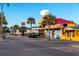 Charming street view with colorful buildings, palm trees, and a water tower on a clear day at 1058 Sea Mountain Hwy. # 4-203, North Myrtle Beach, SC 29582