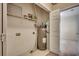 Functional utility area featuring a water heater, shelving, and hookups, offering practical storage and appliance space at 1058 Sea Mountain Hwy. # 4-203, North Myrtle Beach, SC 29582