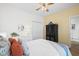 Bedroom with a large bed, modern decor, and a ceiling fan for added comfort at 1058 Sea Mountain Hwy. # 9-101, North Myrtle Beach, SC 29582