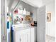 Bright laundry area featuring a washer, dryer and ample shelving space for storage at 1058 Sea Mountain Hwy. # 9-101, North Myrtle Beach, SC 29582