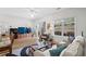 Bright living room with a sliding glass door, ceiling fan, wood-look floors, and a large sofa at 1058 Sea Mountain Hwy. # 9-101, North Myrtle Beach, SC 29582