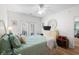 Bright bedroom featuring a large bed, ceiling fan, and access to a private outdoor patio at 1058 Sea Mountain Hwy. # 9-101, North Myrtle Beach, SC 29582