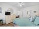 Bright bedroom with dresser, ceiling fan, and ensuite bathroom entrance at 1058 Sea Mountain Hwy. # 9-101, North Myrtle Beach, SC 29582