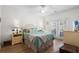 Bright bedroom featuring a large bed, ceiling fan, and access to a private outdoor patio at 1058 Sea Mountain Hwy. # 9-101, North Myrtle Beach, SC 29582