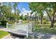 Scenic pond view with lush landscaping and a charming white bridge at 1058 Sea Mountain Hwy. # 9-101, North Myrtle Beach, SC 29582