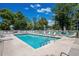 Inviting community pool with clear blue water, lounge chairs, and lush surroundings at 1058 Sea Mountain Hwy. # 9-101, North Myrtle Beach, SC 29582