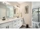 Modern bathroom featuring double sink vanity and a separate tiled shower at 109 Obd Way, Myrtle Beach, SC 29588