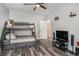 Bedroom with a bunk bed, ceiling fan, and storage beneath the bed at 109 Obd Way, Myrtle Beach, SC 29588