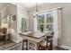 Dining area with bright light, a chandelier, and natural views through large windows at 109 Obd Way, Myrtle Beach, SC 29588