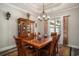 Spacious dining room featuring a large wooden table and elegant chandelier at 109 Obd Way, Myrtle Beach, SC 29588