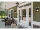 Close-up on the front door featuring inviting outdoor seating at 109 Obd Way, Myrtle Beach, SC 29588