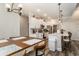 Open-concept kitchen with white cabinets, stainless steel appliances, and breakfast bar at 109 Obd Way, Myrtle Beach, SC 29588