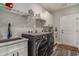 Bright laundry room with new washer and dryer units, folding table, and plentiful storage at 109 Obd Way, Myrtle Beach, SC 29588