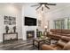 Comfortable living room featuring a fireplace, television, and views of the backyard at 109 Obd Way, Myrtle Beach, SC 29588