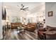Spacious living room with leather furniture, ceiling fan, and open access to the kitchen at 109 Obd Way, Myrtle Beach, SC 29588