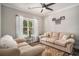 Cozy living room with plush sofas and a large window overlooking the yard at 109 Obd Way, Myrtle Beach, SC 29588