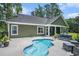 Backyard featuring a kidney-shaped pool with patio furniture and a view of the home's exterior at 109 Obd Way, Myrtle Beach, SC 29588