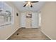 Bedroom with wood-look flooring, ceiling fan, and mounted flat screen TV at 1107 Blue Ridge Trail, North Myrtle Beach, SC 29582