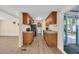 Galley kitchen with wood cabinets, light countertops and stainless appliances at 1107 Blue Ridge Trail, North Myrtle Beach, SC 29582
