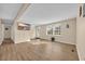 Bright and airy living room with wood flooring, television, and ample natural light at 1107 Blue Ridge Trail, North Myrtle Beach, SC 29582