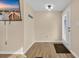 Bright room featuring a light wood floor, television, and a door to the outside at 1107 Blue Ridge Trail, North Myrtle Beach, SC 29582