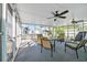 Inviting sunroom with comfortable seating, ceiling fans, and lots of light at 1107 Blue Ridge Trail, North Myrtle Beach, SC 29582