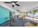 Relaxing sunroom with comfortable seating, ceiling fans, and lots of light at 1107 Blue Ridge Trail, North Myrtle Beach, SC 29582