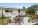 Backyard patio area for outdoor dining and entertaining, with a view of the home and yard at 1127 Pine Dr., Myrtle Beach, SC 29577