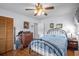 Bedroom with hardwood floors, ceiling fan, closet, and neutral walls at 1127 Pine Dr., Myrtle Beach, SC 29577