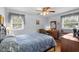 Well-lit bedroom featuring hardwood floors, a ceiling fan, and dual windows at 1127 Pine Dr., Myrtle Beach, SC 29577