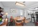 Bright dining area showing table and chairs and connection to kitchen with breakfast bar at 1127 Pine Dr., Myrtle Beach, SC 29577
