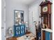 Inviting entryway featuring a decorative mirror, blue accent cabinet, and classic grandfather clock at 1127 Pine Dr., Myrtle Beach, SC 29577