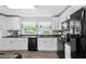 Bright kitchen with white cabinets, modern appliances, and plenty of natural light at 1127 Pine Dr., Myrtle Beach, SC 29577
