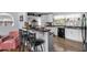 Modern kitchen with white cabinets, a breakfast bar, and stainless steel appliances at 1127 Pine Dr., Myrtle Beach, SC 29577