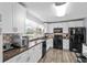 Modern kitchen with white cabinets, stainless appliances, and ample counter space at 1127 Pine Dr., Myrtle Beach, SC 29577