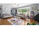 Bright living room featuring a large bay window and neutral decor at 1127 Pine Dr., Myrtle Beach, SC 29577