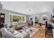 Comfortable living room with large windows, hardwood floors, and decorative archways at 1127 Pine Dr., Myrtle Beach, SC 29577