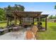 Relaxing outdoor pergola area with comfortable seating, perfect for entertaining guests at 1127 Pine Dr., Myrtle Beach, SC 29577