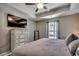 Serene bedroom featuring tray ceilings, a large window, and soothing neutral color palette at 113 Adelphia Rd., Loris, SC 29569