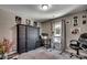 This bedroom boasts a large armoire and a window with natural light creating a comfy space at 113 Adelphia Rd., Loris, SC 29569