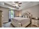Comfortable bedroom with a large bed, tray ceiling, and soft neutral tones at 113 Adelphia Rd., Loris, SC 29569