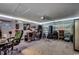 Spacious bonus room featuring wall decor, instruments, a garage door, and recessed lighting at 113 Adelphia Rd., Loris, SC 29569