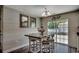 Cozy eat-in kitchen area with shiplap accent wall, views to the fenced in backyard, and decorative lighting at 113 Adelphia Rd., Loris, SC 29569