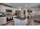 Modern kitchen showcasing stainless steel appliances, white cabinets, and an island with a dark countertop at 113 Adelphia Rd., Loris, SC 29569