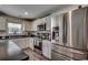 Well-appointed kitchen with stainless steel appliances, dark countertops and wood-look flooring at 113 Adelphia Rd., Loris, SC 29569