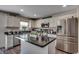 Bright kitchen featuring stainless appliances, granite countertops, white cabinetry and central island at 113 Adelphia Rd., Loris, SC 29569